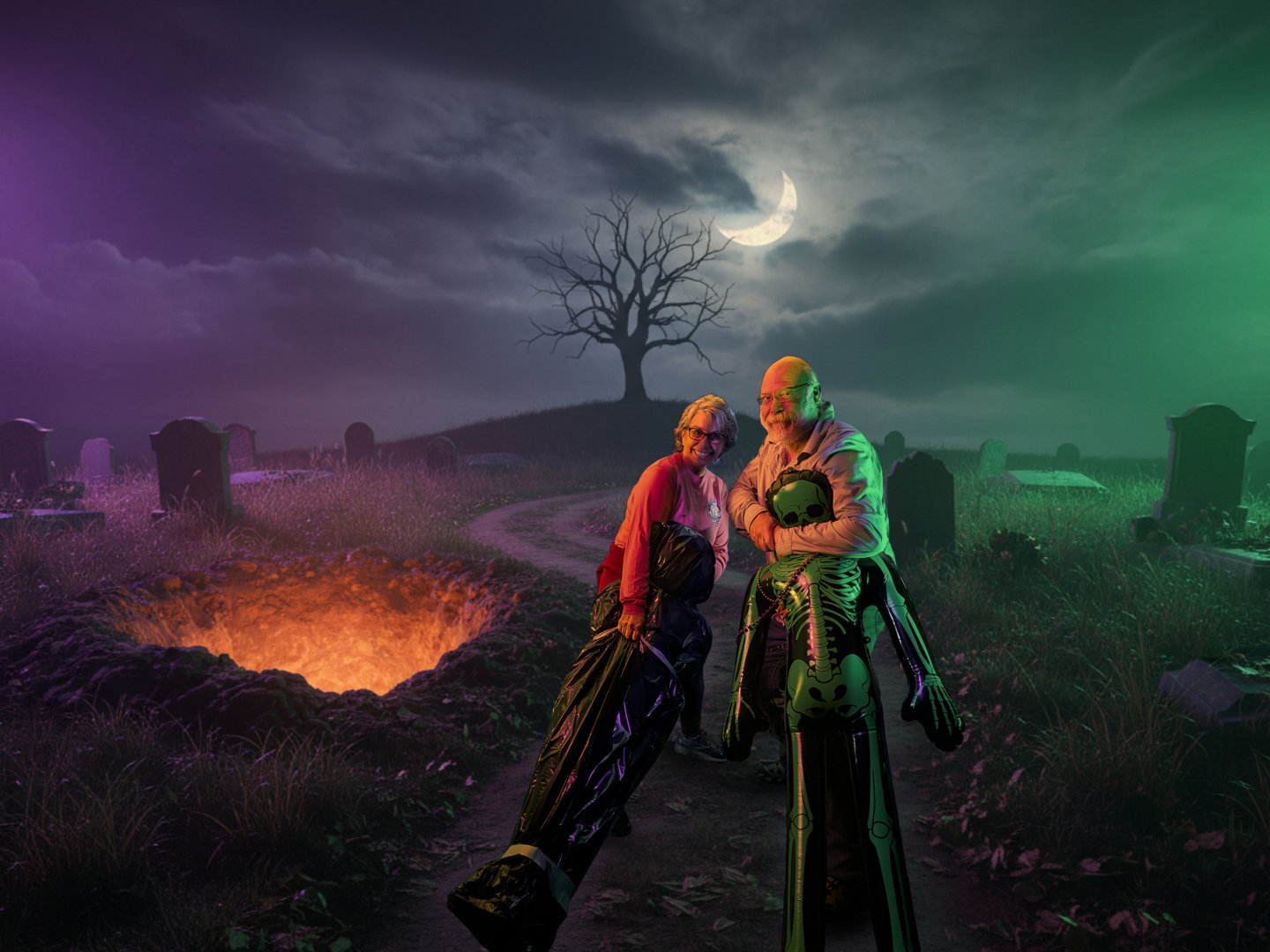 2 people holding dead body props at a gravesite